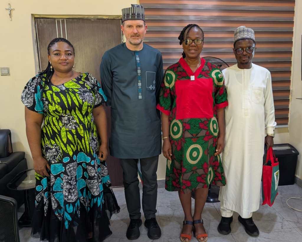 Four people are framed to commemorate a short meeting at the National University of Nigeria where Mike met  Prof. Bridget A.M. Yakubu (Directorate of Advancement & Linkages [DAL] to enquire about potential collaborations in education research